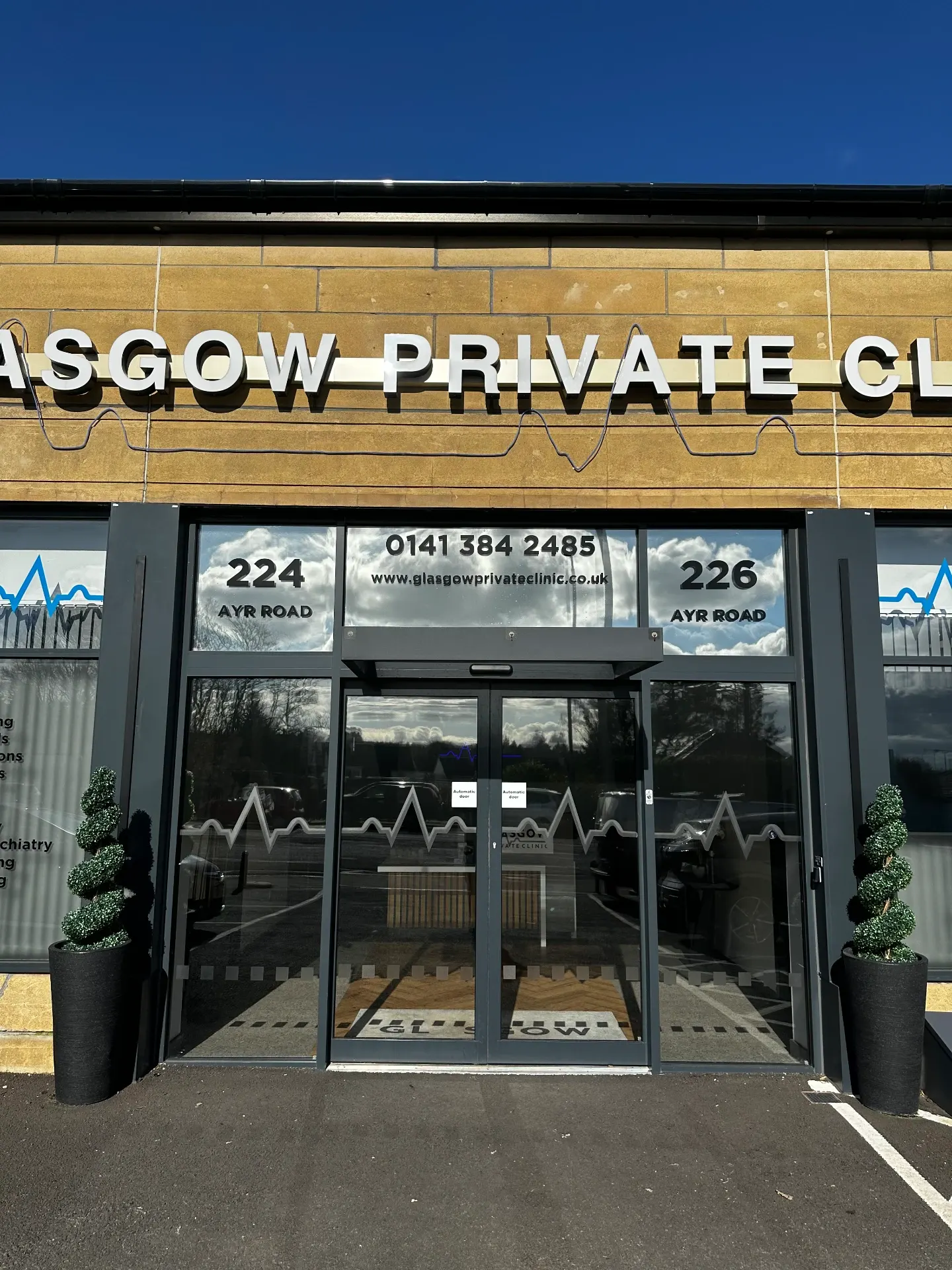 Glare reduction film to upper glazing, cut to match existing heartbeat manifestations — Glasgow Private Clinic, commercial signage by L4 Signs Glasgow