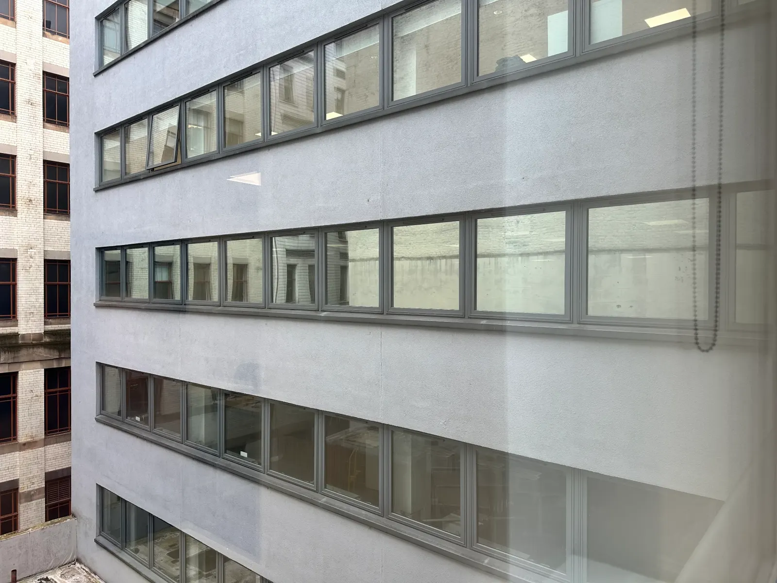 Mirrored window film seen from inside a Glasgow office looking across to the neighbouring building